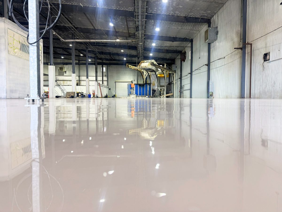 Glossy epoxy floor coating system installed in an industrial warehouse